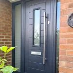 a building with a brick wall and an urban composite door