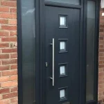 a building with a brick wall and an urban composite door