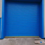 Small Industrial Light blye roller shooter door a the entrance to a factory