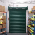 Green roller shutter door in a store room